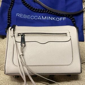 Sale! Rebecca Minkoff light gray crossbody bag with chain strap and tassels.